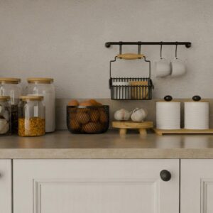 Stylish kitchen setup featuring organic storage jars, herbs, and minimalistic decor on a beige countertop.
